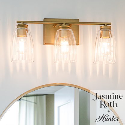 Hunter Rossmoor Luxe Gold with Clear Fluted Glass 3 Light Bathroom Vanity Wall Light Fixture